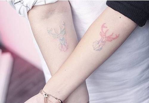 Matching polygonal deer head tattoos. Tattoo artist: Mini Lau spectrum;geometric shape;small;matching;violet;watercolor;tiny;blue;polygon;pink;little;forearm;green;other;minilau;deer;animal